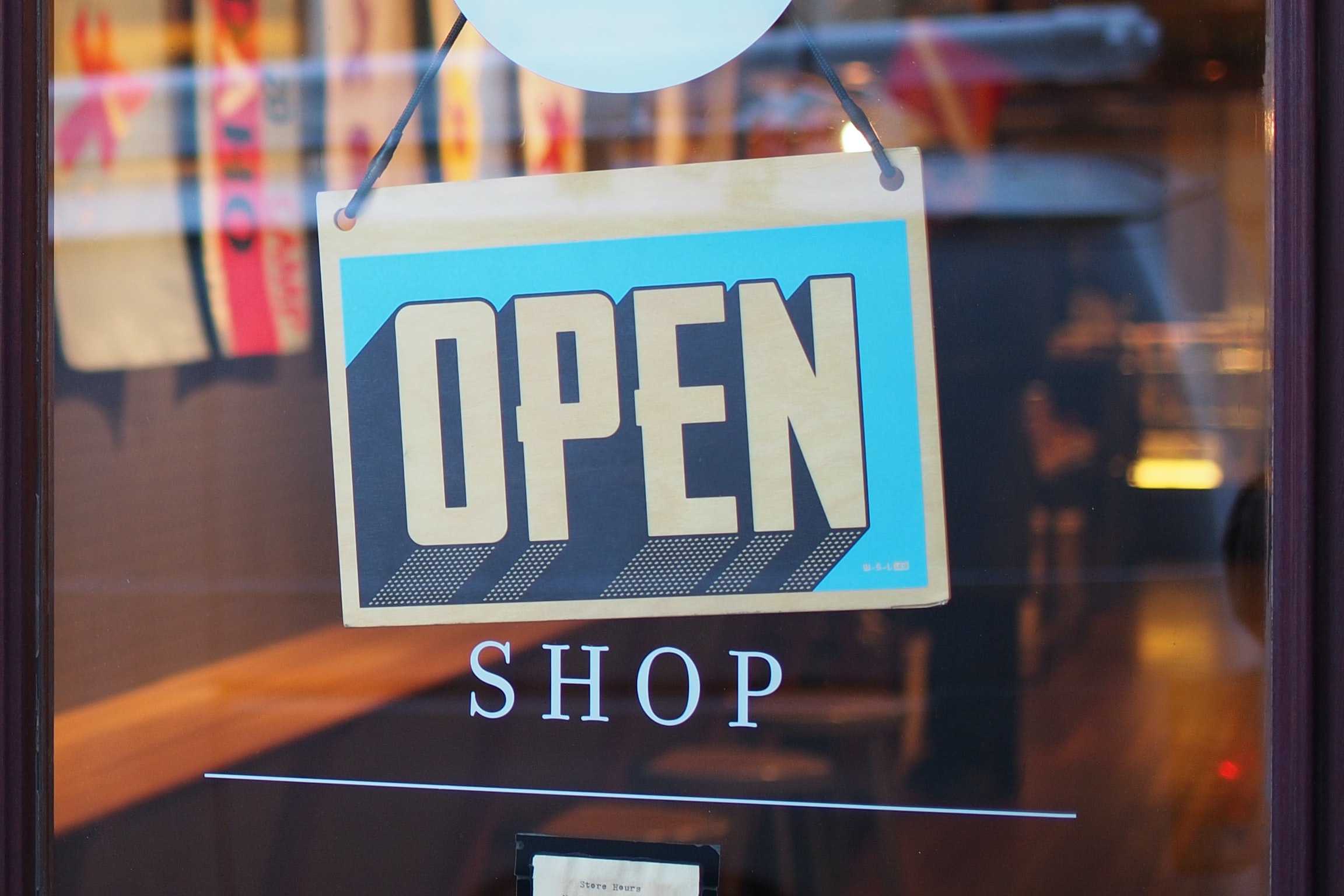 Retail Shop "Open" for business sign Photo by Mike Petrucci